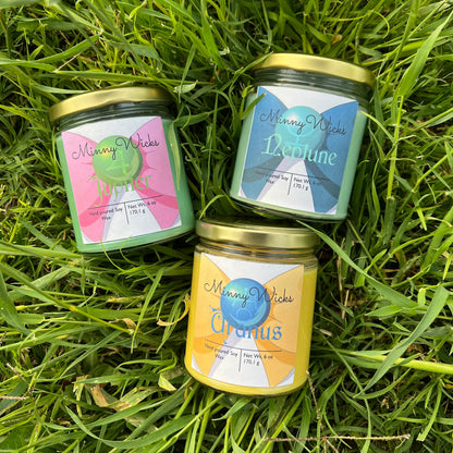 Three small jars with labels on a grassy background